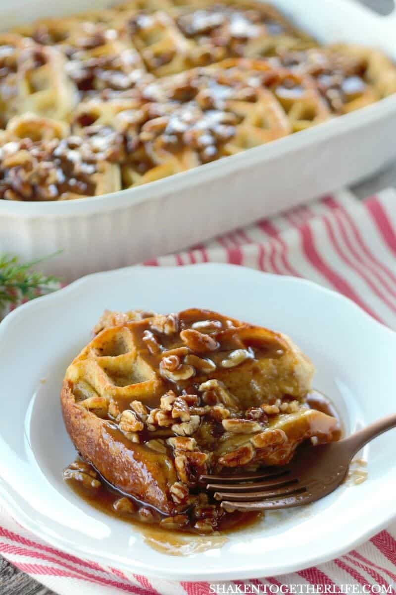 Overnight Waffle Breakfast Casserole with Brown Sugar Pecan Sauce with fork on white plate