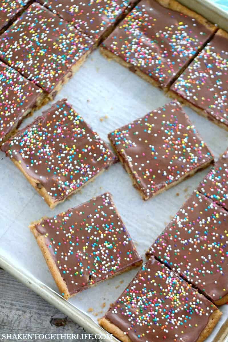 Dessert doesn't get easier than these Frosted Sheet Pan Cookie Bars! One pan, no tools and a frosting hack that will change your life!