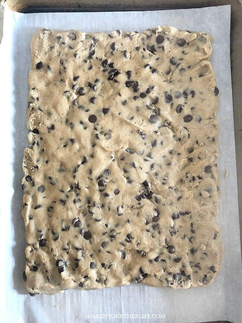 Frosted Sheet Pan Cookie Bars - your favorite cookie dough gets spread out on an 11x17 sheet pan and then popped in the oven.