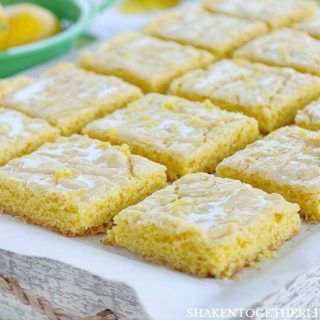Lemon Glazed Lemon Bars from a cake mix are an easy lemon dessert with big lemon flavor! The 2 ingredient lemon glaze and lemon zest add freshness to these easy lemon bars!