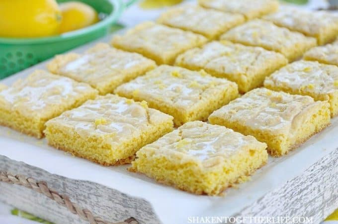 Lemon Glazed Lemon Bars from a cake mix are an easy lemon dessert with big lemon flavor! The 2 ingredient lemon glaze and lemon zest add freshness to these easy lemon bars!