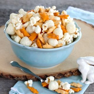 Cheesy Easter Snack Mix! With 4 cheesy ingredients, this savory snack mix is quick to mix up for a pre-dinner treat, egg hunt fuel or a party favor for any Easter or Spring get together!