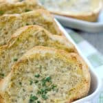 With a buttery, garlic spread loaded with flavorful pesto and nutty Parmesan cheeses, this Homemade Pesto Parmesan Garlic Bread will disappear from the dinner table!