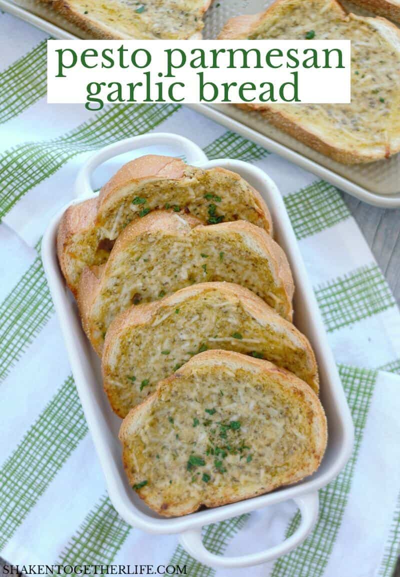 pesto parmesan garlic bread in text over picture of slices of bread in white serving platter