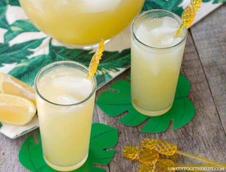 Skinny Sparkling Pineapple Lemonade Punch has 3 ingredients and just 50 calories per glass! This easy to make sparkling pineapple lemonade is perfect to make for parties and sip by the pool all Summer long!