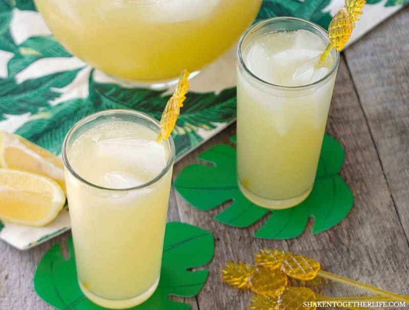 Skinny Sparkling Pineapple Lemonade Punch has 3 ingredients and just 50 calories per glass! This easy to make sparkling pineapple lemonade is perfect to make for parties and sip by the pool all Summer long!