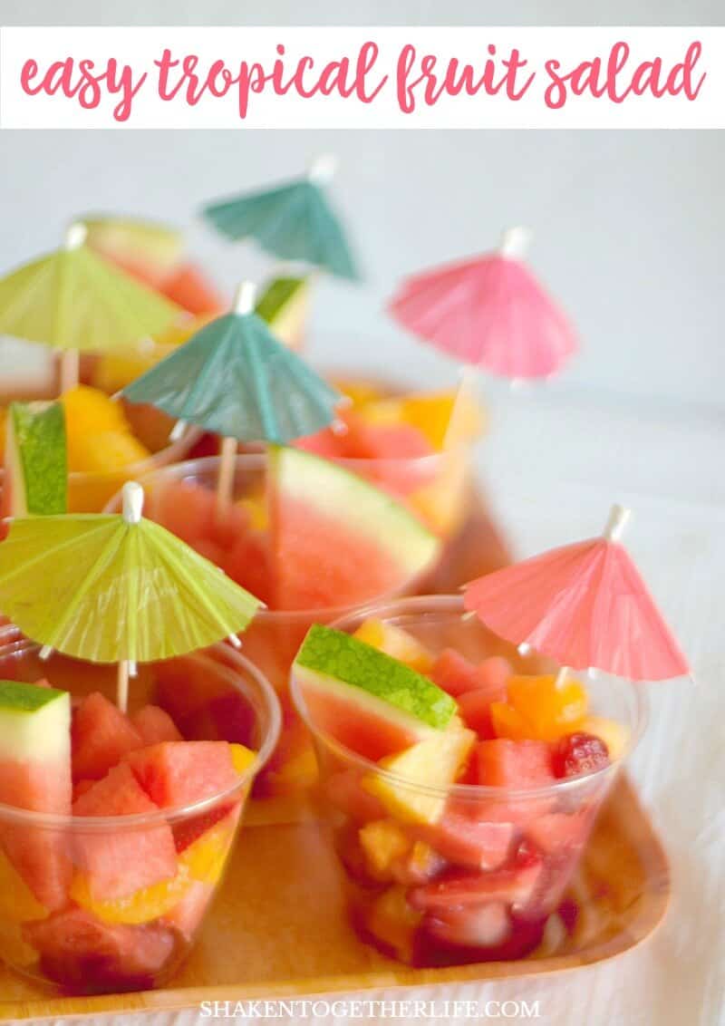 Easy Tropical Fruit Salad served with a paper party umbrella is sweet, healthy & refreshing! It makes the perfect dessert for a Tropical Summer Craft Party!