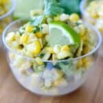 close up of corn avocado salsa in clear bowl