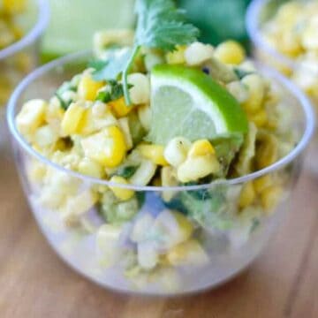 close up of corn avocado salsa in clear bowl