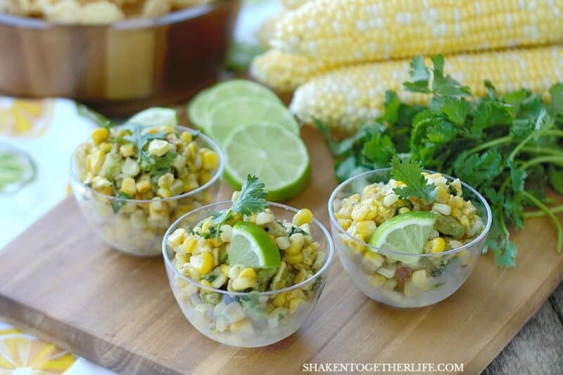 corn and avocado salsa in three small clear bowls