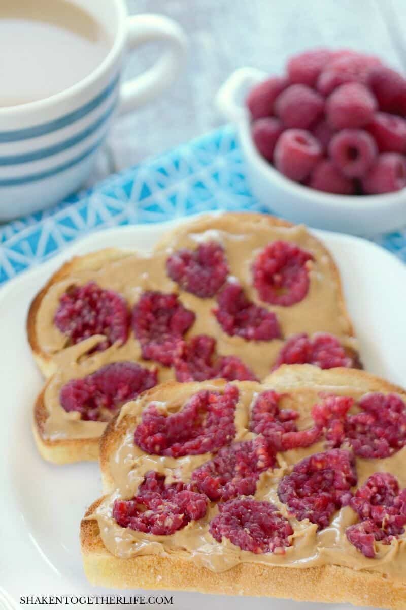 Smashed Berry Breakfast Toast with peanut butter and raspberries