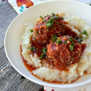 white bowl with mashed potatoes and porcupine meatballs