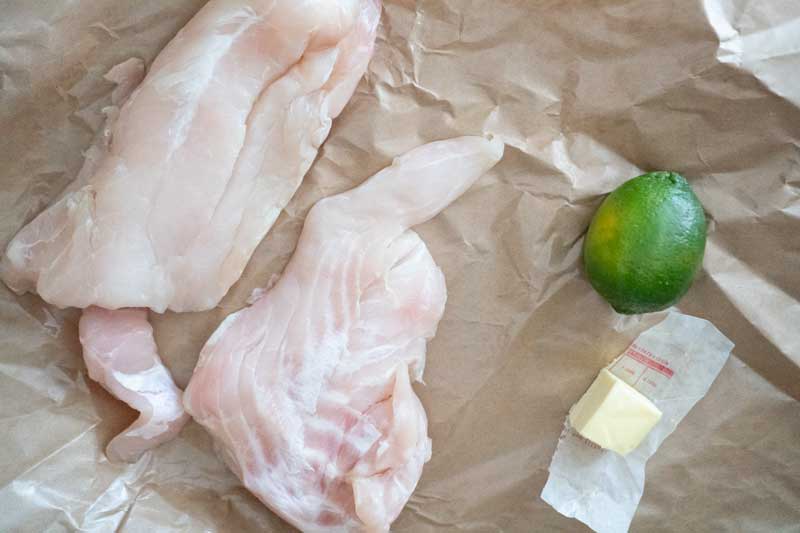 grouper fillets with lime and butter on paper