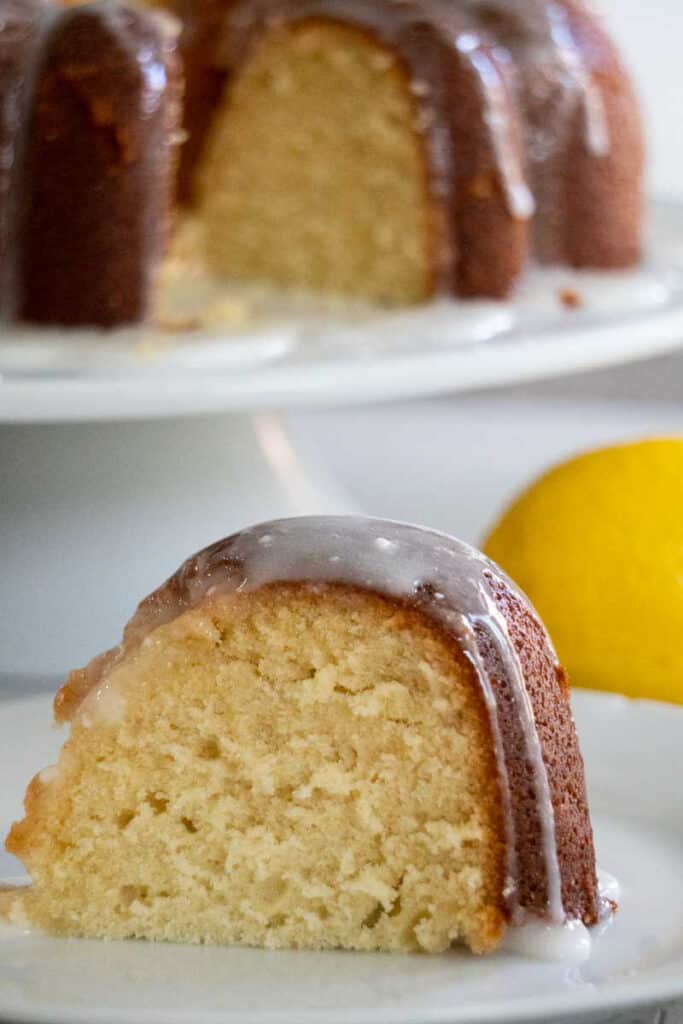 lemon bundt cake on white cake stand