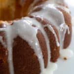 lemon bundt cake on white cake stand