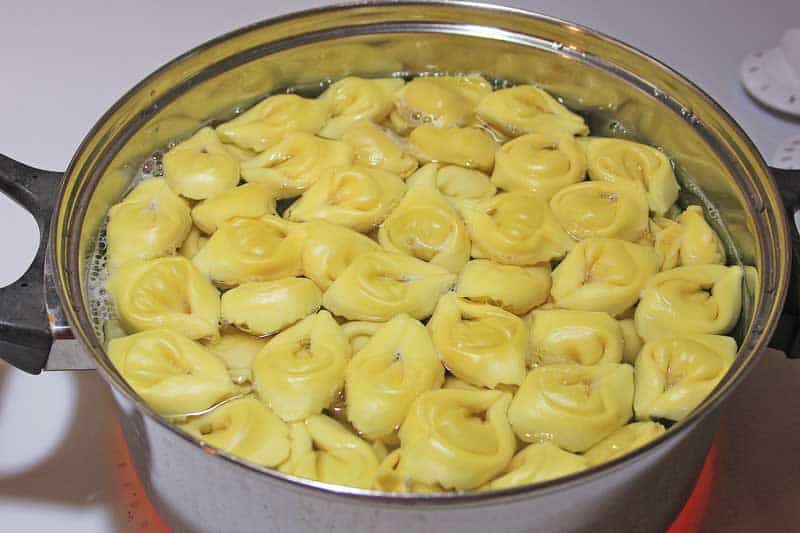 tortellini cooking in pot