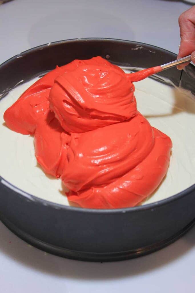 adding red layer to layered valentine's no bake cheesecake