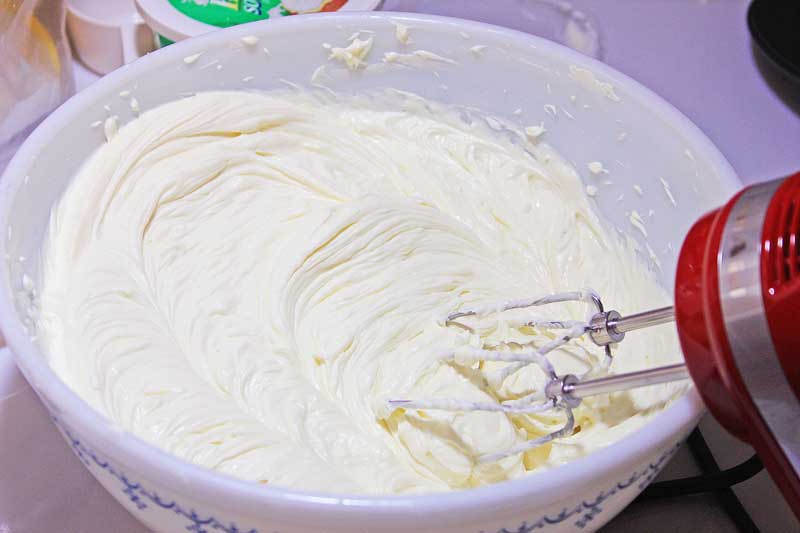mixing layered valentine's no bake cheesecake