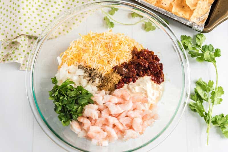 shrimp nacho ingredients in glass bowl