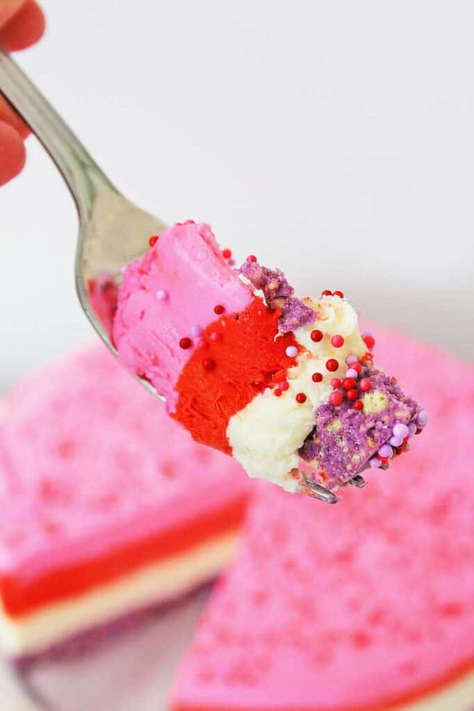 layered valentine's no bake cheesecake on fork
