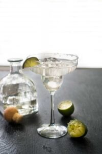 agave margarita in glass with lime