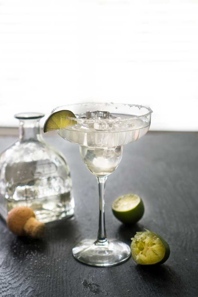 agave margarita in glass with lime