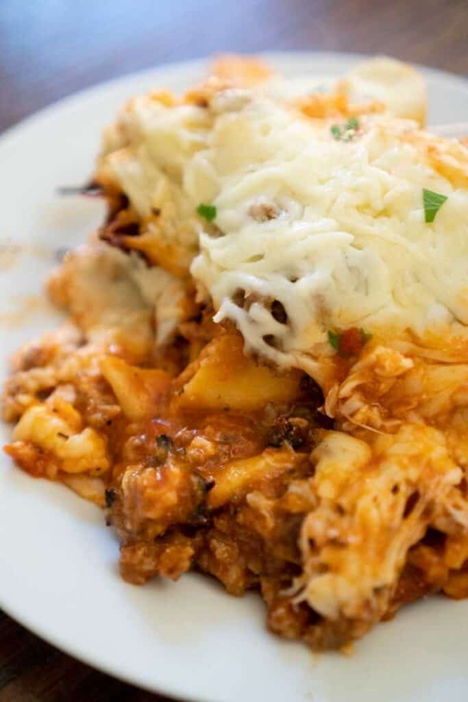 lazy lasagna made with ravioli on white plate