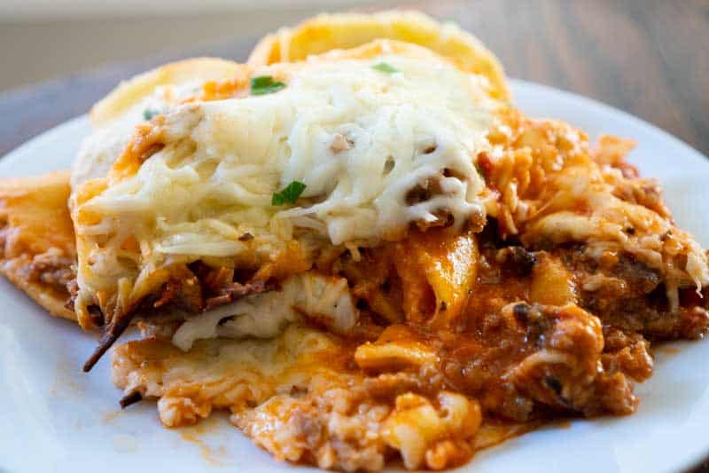 lazy lasagna with ravioli on white plate