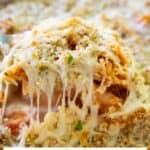 ziti al forno in serving spoon with text reading ziti al forno copycat olive garden recipe