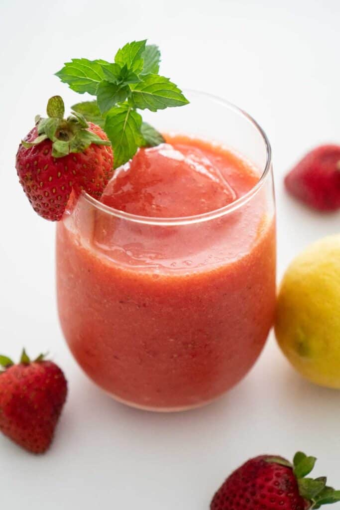 frozen strawberry lemonade in a stemless wine glass