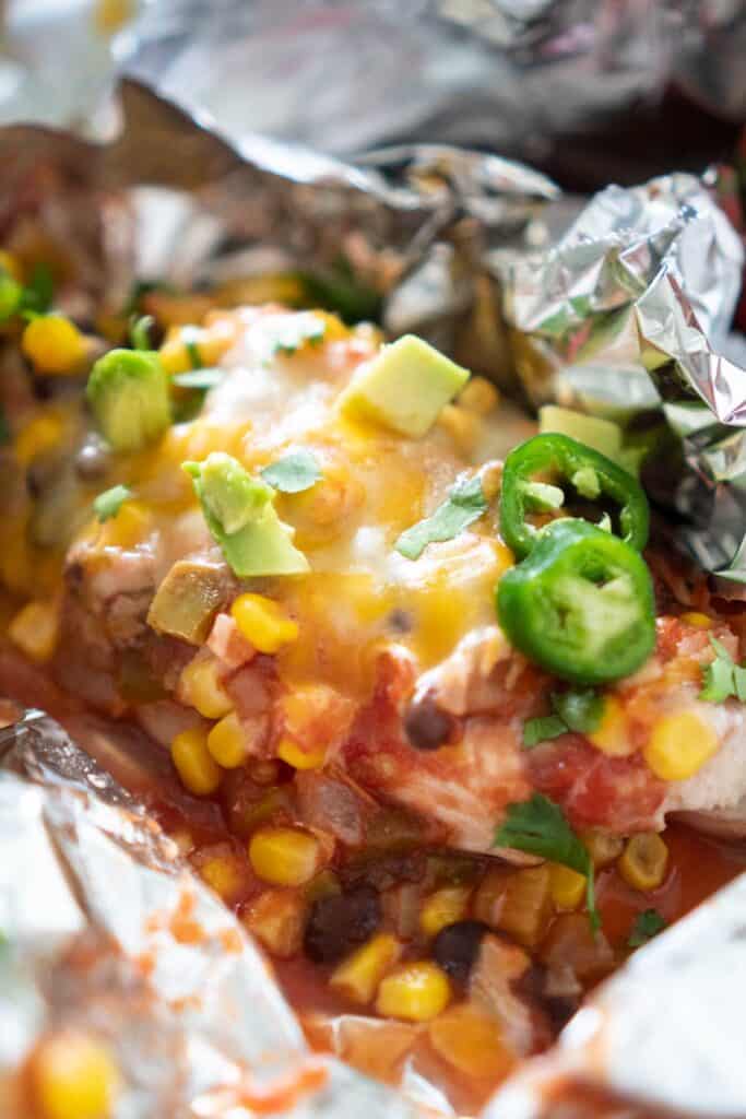 close up of salsa chicken in foil
