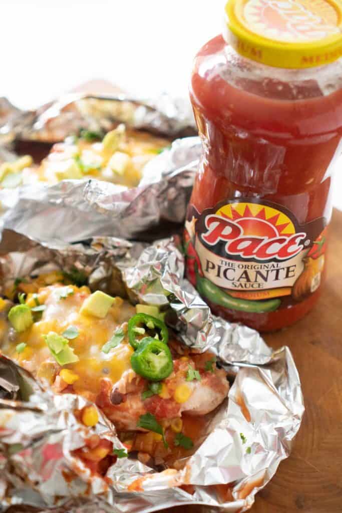 salsa chicken in foil with bottle of pace salsa
