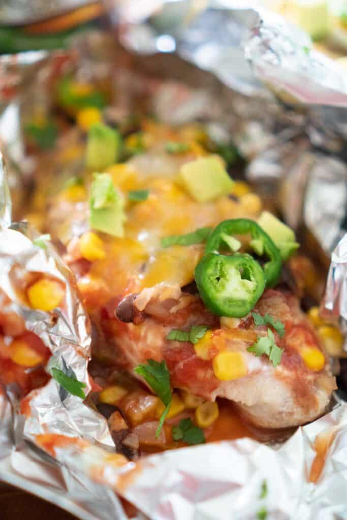 close up of salsa chicken in foil