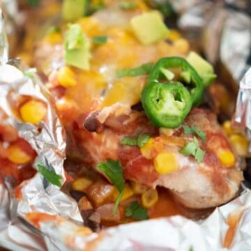 close up of salsa chicken in foil