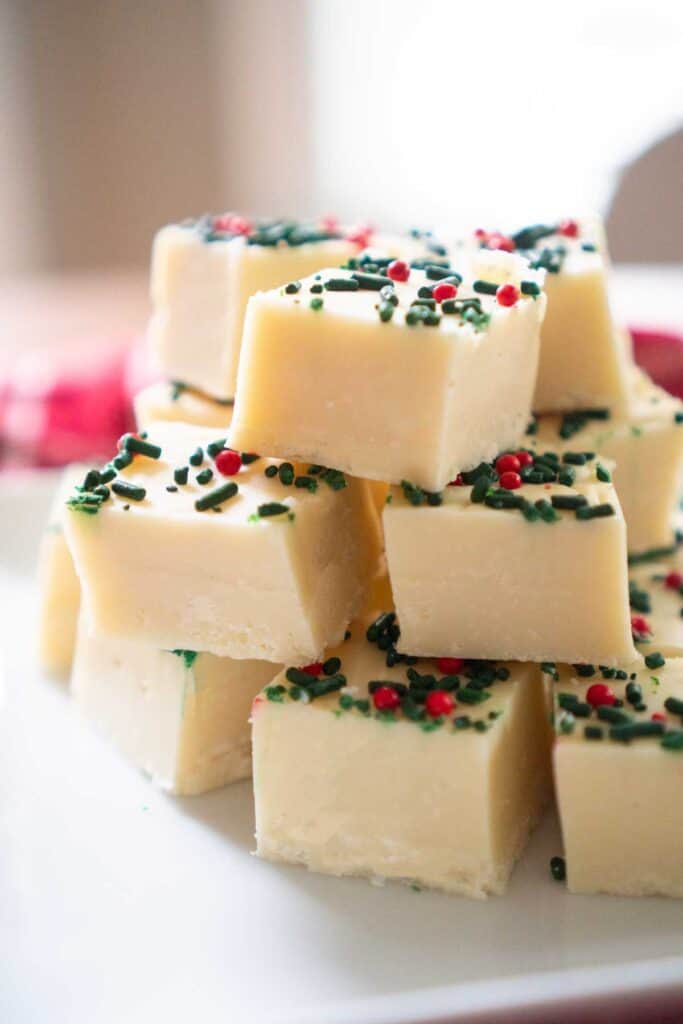 stack of white chocolate fudge with christmas sprinkles