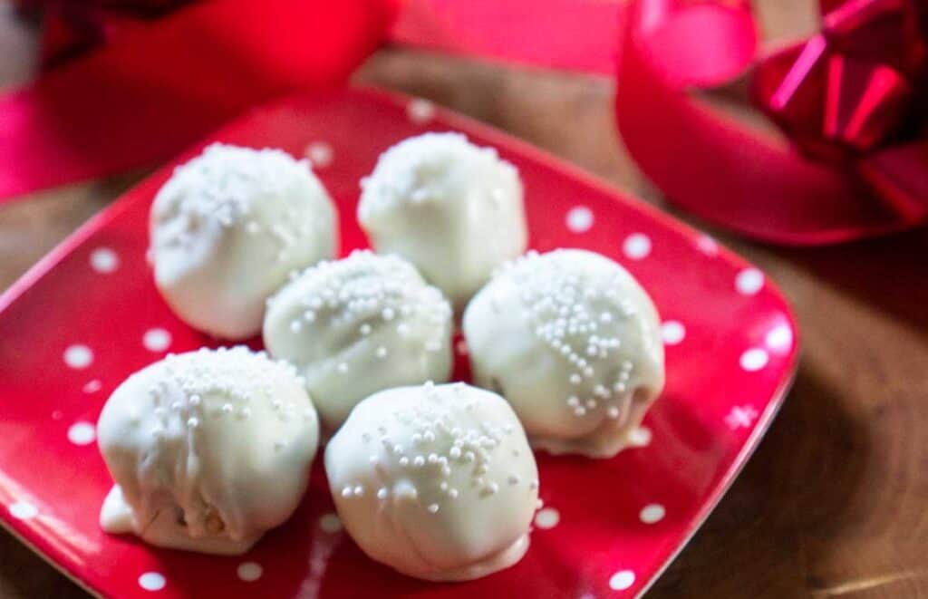 white chocolate truffles on red polka dot plate