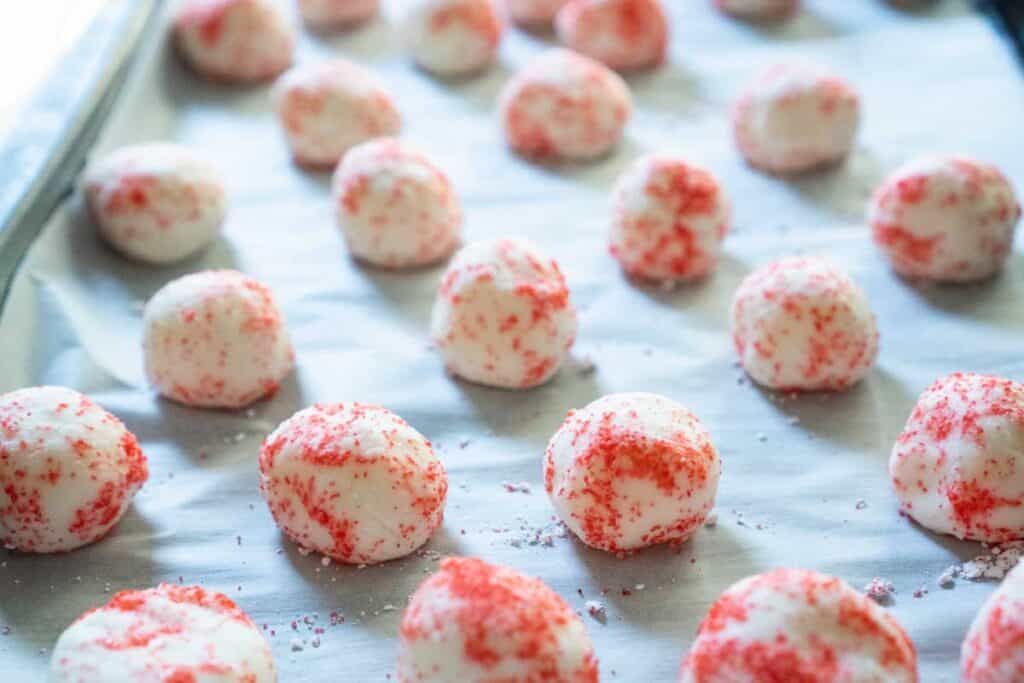 cream cheese mints on parchment-lined baking sheet