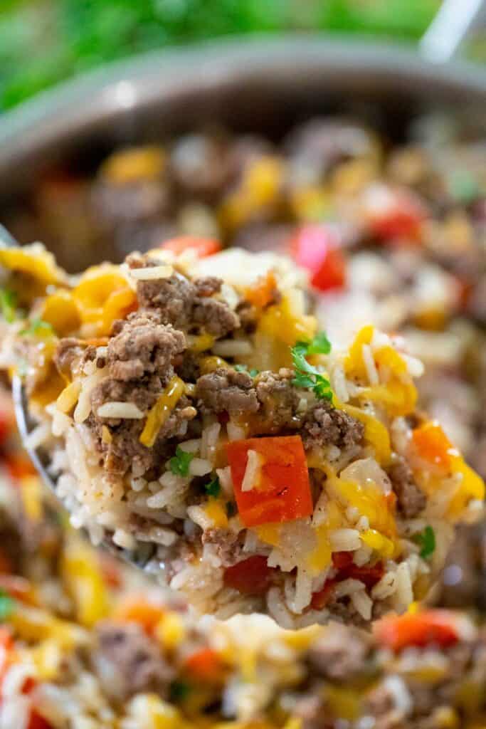 spoon with beef and rice skillet with cheese