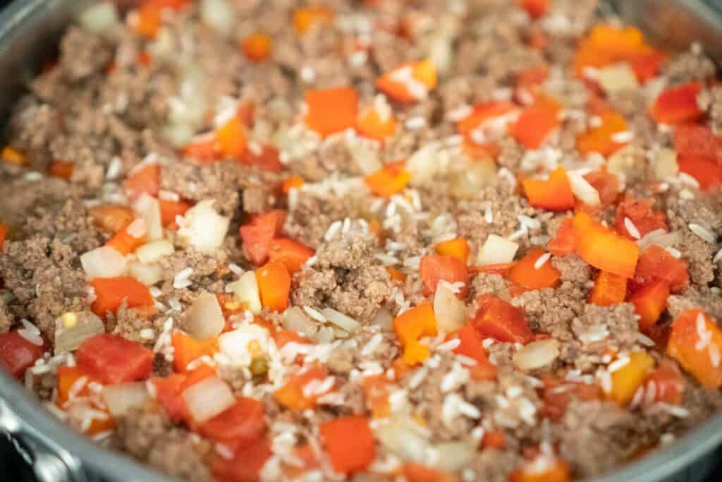 beef, rice, and tomatoes in skillet