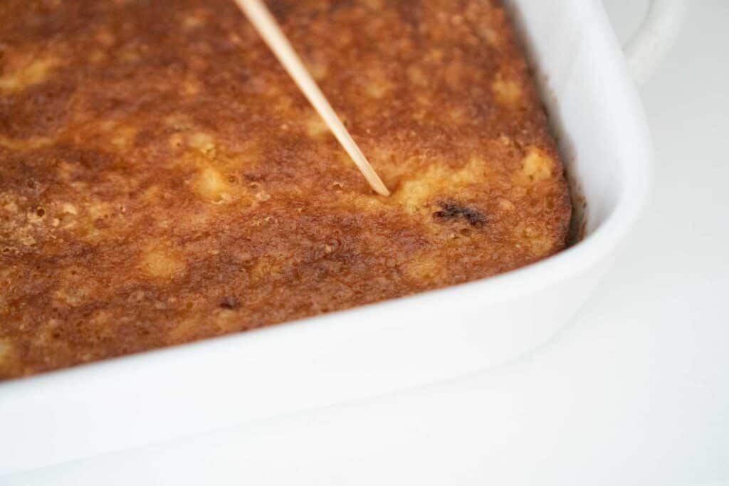 skewer poking holes in cake