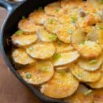 cheesey ground beef and potatoes in cast iron skillet