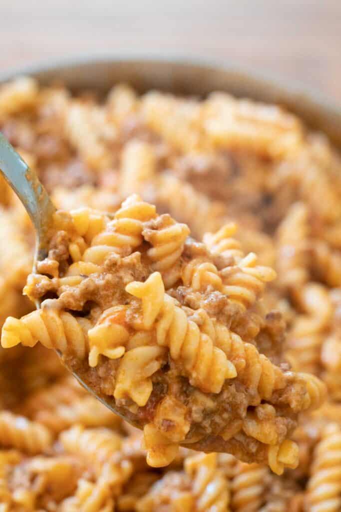 close up of spoon with ground beef pasta