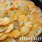 cheesey ground beef and potatoes in cast iron skillet with overlay text
