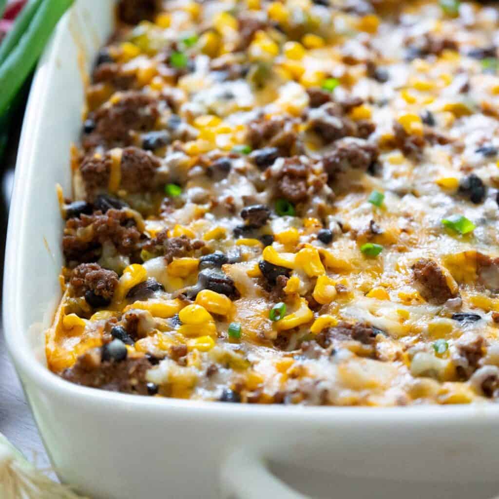 Mexican ground beef casserole in white dish