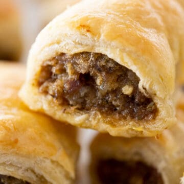 extreme close up of sausage rolls stack on one another