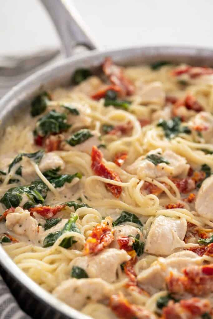 large skillet with creamy Tuscan chicken pasta