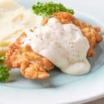 chicken fried chicken with white gravy and mashed potatoes