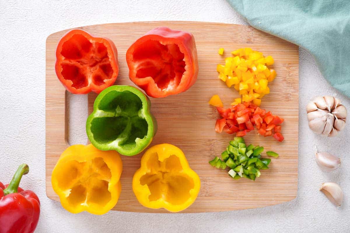 hollowed out bell peppers on cutting board