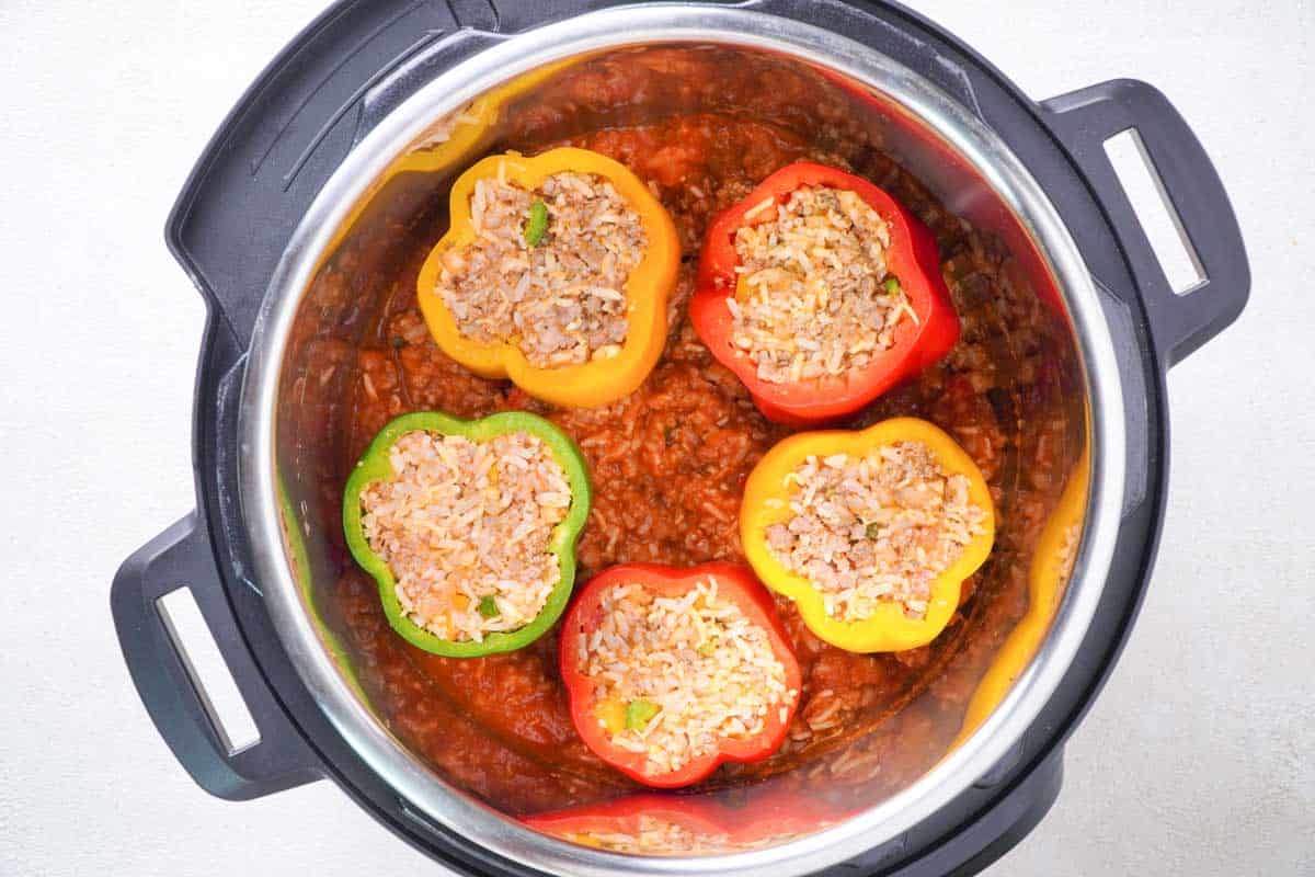 overhead view of stuffed bell peppers in slow cooker