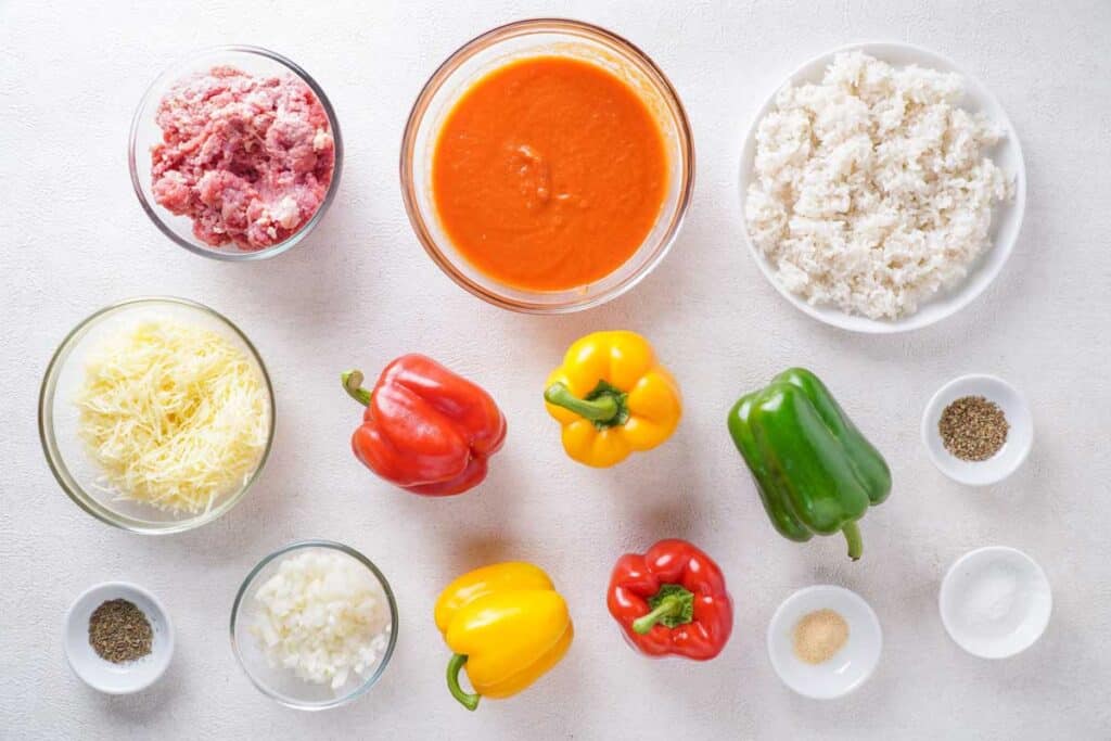 stuffed pepper ingredients laid our in bowls on counter